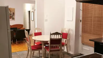 a kitchen and dining room with a table and chairs at Appartement centre-ville Montréal 1215 LT in Montréal