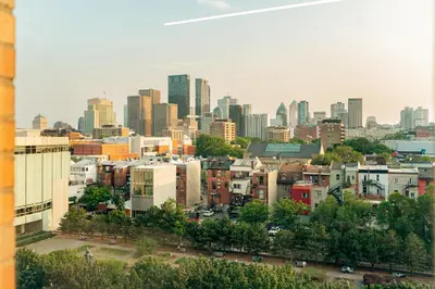 a view of a city skyline with tall buildings at Top Location - Cozy & Bright MTL studio near metro in Montréal
