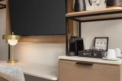 a kitchen with a coffee maker on a counter at Hotel Railwayparc Montreal, Tapestry Collection By Hilton in Montréal