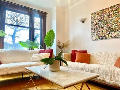 a living room with a couch and a table at Beautiful Sunny big apartment in Montréal