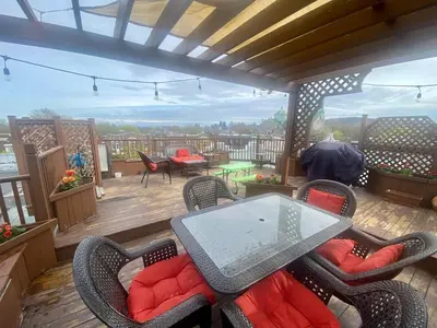 a patio with a table and chairs on a balcony at Beautiful Sunny big apartment in Montréal