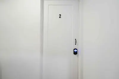 a white door with two numbers on it at Room n2-Apartment 1 in a SHARED apartment in downtown Montreal in Montréal