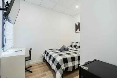 a bedroom with a bed and a desk in a room at Room n4-Apartment 1 in a SHARED apartment in downtown Montreal in Montréal