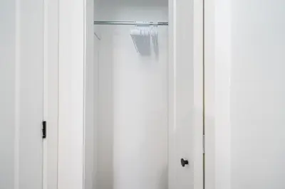 a glass shower door with a shower head at Room in montreal in Montréal