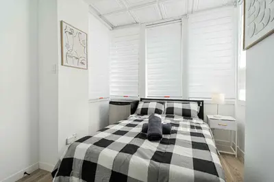 a bedroom with a black and white checkered bed at Room n7-Apartment 1 in a SHARED apartment in downtown Montreal in Montréal