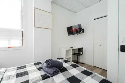 a bedroom with a bed with towels on it at Room n7-Apartment 1 in a SHARED apartment in downtown Montreal in Montréal
