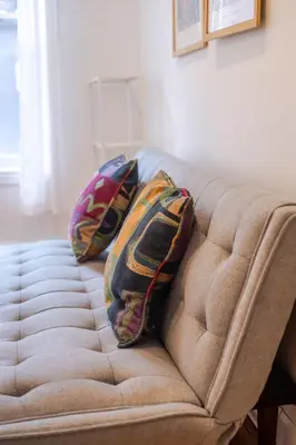 two pillows on a couch in a living room at Charming 2BR in Plateau Mont-Royal in Montréal