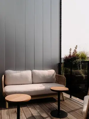 a living room with a couch and two tables at Maison Grinder in Montréal