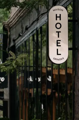 a sign that says holt on a gate at Maison Grinder in Montréal