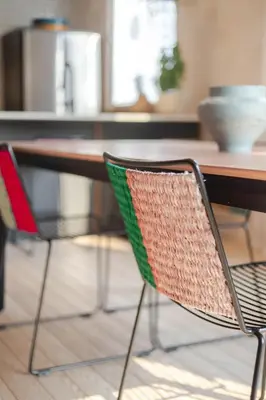 a wooden table with two chairs at a table at Bel appartement confortable - Emplacement idéal in Montréal