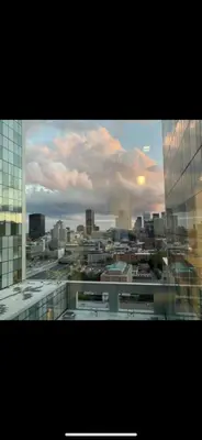 a view of a city from a window of a building at Condo spacieux in Montréal