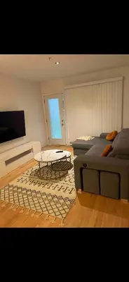 a living room with a couch and a coffee table at Condo spacieux in Montréal