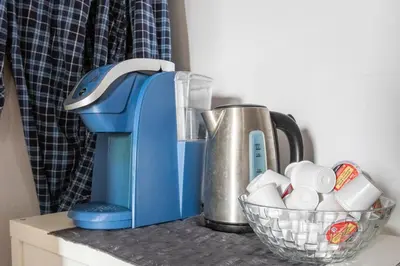 a blue mixer sitting on top of a counter at Huge King Room in 3 BedRoom Great Location Downtown Mtl in Montréal