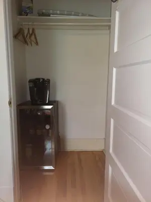 a room with a door leading into a room with a kitchen at Huge King Room in 3 BedRoom Great Location Downtown Mtl in Montréal