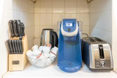 a kitchen counter with a mixer and a toaster at Huge King Room in 3 BedRoom Great Location Downtown Mtl in Montréal