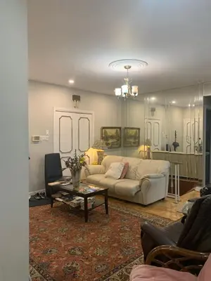 a living room with a couch and a table at Montreal Accommodation Steps Downtown 17mins airport in Montréal
