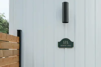 a door with a sign that reads spa bathroomuce at room with shared bathrooms 883 Shefford in Bromont