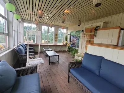 a living room with a couch and a table at Gîte champêtre Chesham in Notre-Dame-Des-Bois