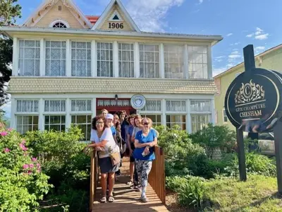 a group of people walking out of a building at Gîte champêtre Chesham in Notre-Dame-Des-Bois