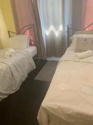 a room with two beds and a window at Montréal Downtown Private Rooms Across Polytechnique in Montréal