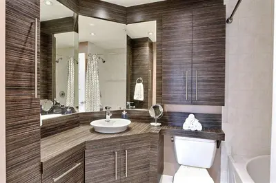 a bathroom with a sink and a toilet and a tub at Sacha's Home Away in Quiet Montreal in Montréal