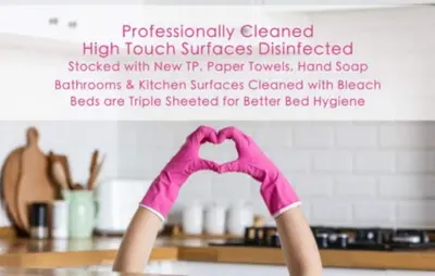 a pair of hands in pink gloves making a heart shape at Ground Floor Loft Style Luxury Executive Flat in Montréal