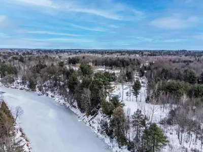 an aerial view of a river in the snow at Chalet Le Mignon Nature Escape & Comfort in Saint Ambroise de Kildare