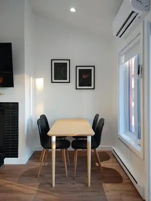 a dining room with a table and chairs at Chalet Tranquillité Orford in Magog-Orford
