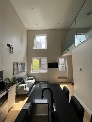 a living room with a couch and a table at Luxury apartment in Mont Royal in Montréal