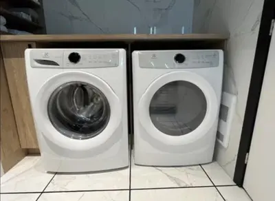 a washing machine and a dryer in a room at Luxury apartment in Mont Royal in Montréal