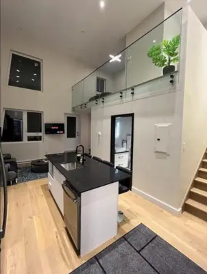 a kitchen with a black counter top in a room at Luxury apartment in Mont Royal in Montréal