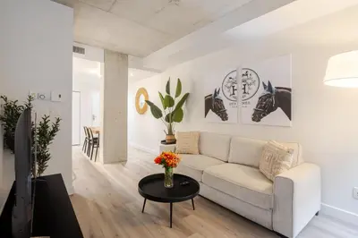 a living room with a couch and a table at Roomy 1BR Getaway MTL Old Port in Montréal