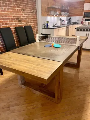 a wooden table with two blue plates on top of it at MTLVacationRentals - The City Chalet in Montréal