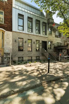 a building with a parking meter in front of it at Habitat in Montréal