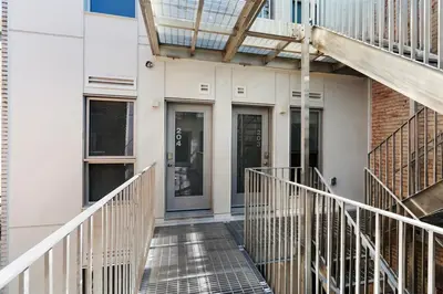 a stairway leading to a door in a building at Habitat in Montréal