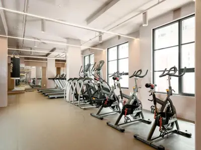 a gym with several treadmills and elliptical machines at Cozy apartment-Old Port Montreal in Montréal