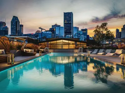 a pool on top of a building with a city skyline at Cozy apartment-Old Port Montreal in Montréal