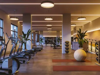 a gym with treadmills and elliptical machines at Cozy apartment-Old Port Montreal in Montréal