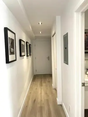 a hallway with paintings on the walls of a room at Loft moderne au coeur de Montreal in Montréal