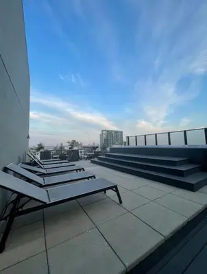 a group of benches on the roof of a building at Loft moderne au coeur de Montreal in Montréal