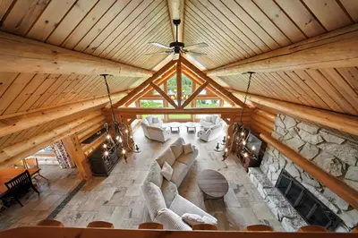 an overhead view of a living room in a log cabin at Impérial du Domaine de la Chasse Gardée in Linière
