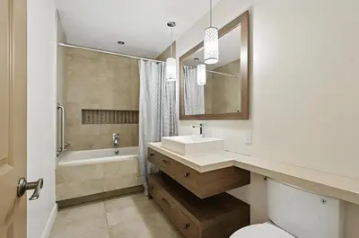 a bathroom with a sink and a tub and a toilet at Impérial du Domaine de la Chasse Gardée in Linière