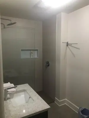 a bathroom with a sink and a shower at Peaceful oasis near airport private entrance in Pointe-Claire