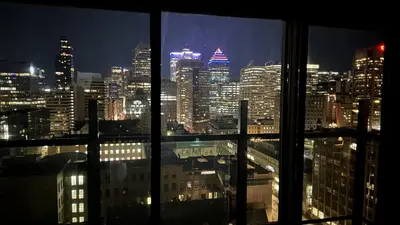 a view of a city skyline at night from a window at Great view 1BDRM APTR in heart of Montreal DWTN in Montréal