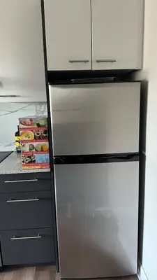 a refrigerator with its door open in a kitchen at Great view 1BDRM APTR in heart of Montreal DWTN in Montréal