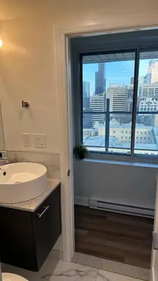 a bathroom with a sink and a window with a view at Great view 1BDRM APTR in heart of Montreal DWTN in Montréal
