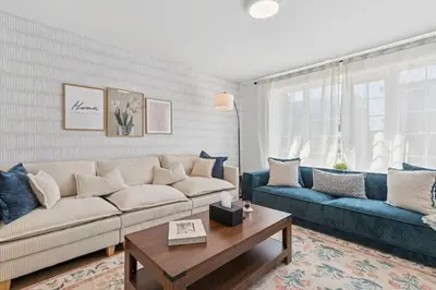 a living room with a couch and a coffee table at Escapade Chambly in Chambly