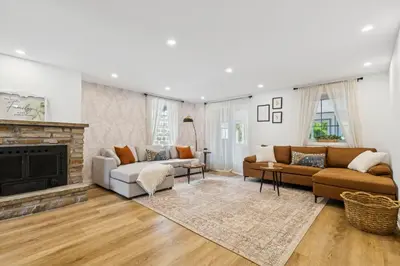 a living room with a couch and a fireplace at Escapade Chambly in Chambly