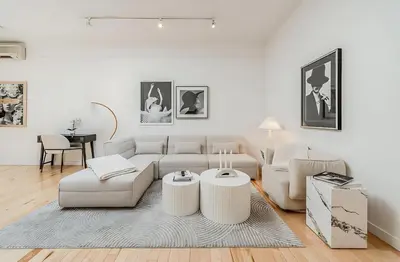 a living room with a couch and two tables at La Galerie Privée Luxe & Impeccable Stay in Montréal