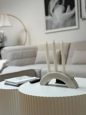 a living room with a table with four candles on it at La Galerie Privée Luxe & Impeccable Stay in Montréal
